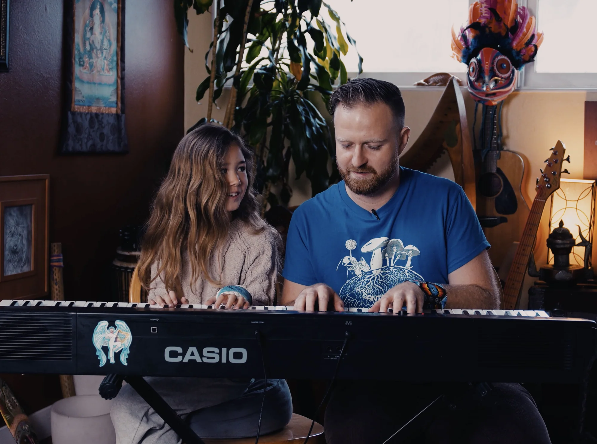 Justin teaching a young student at the piano