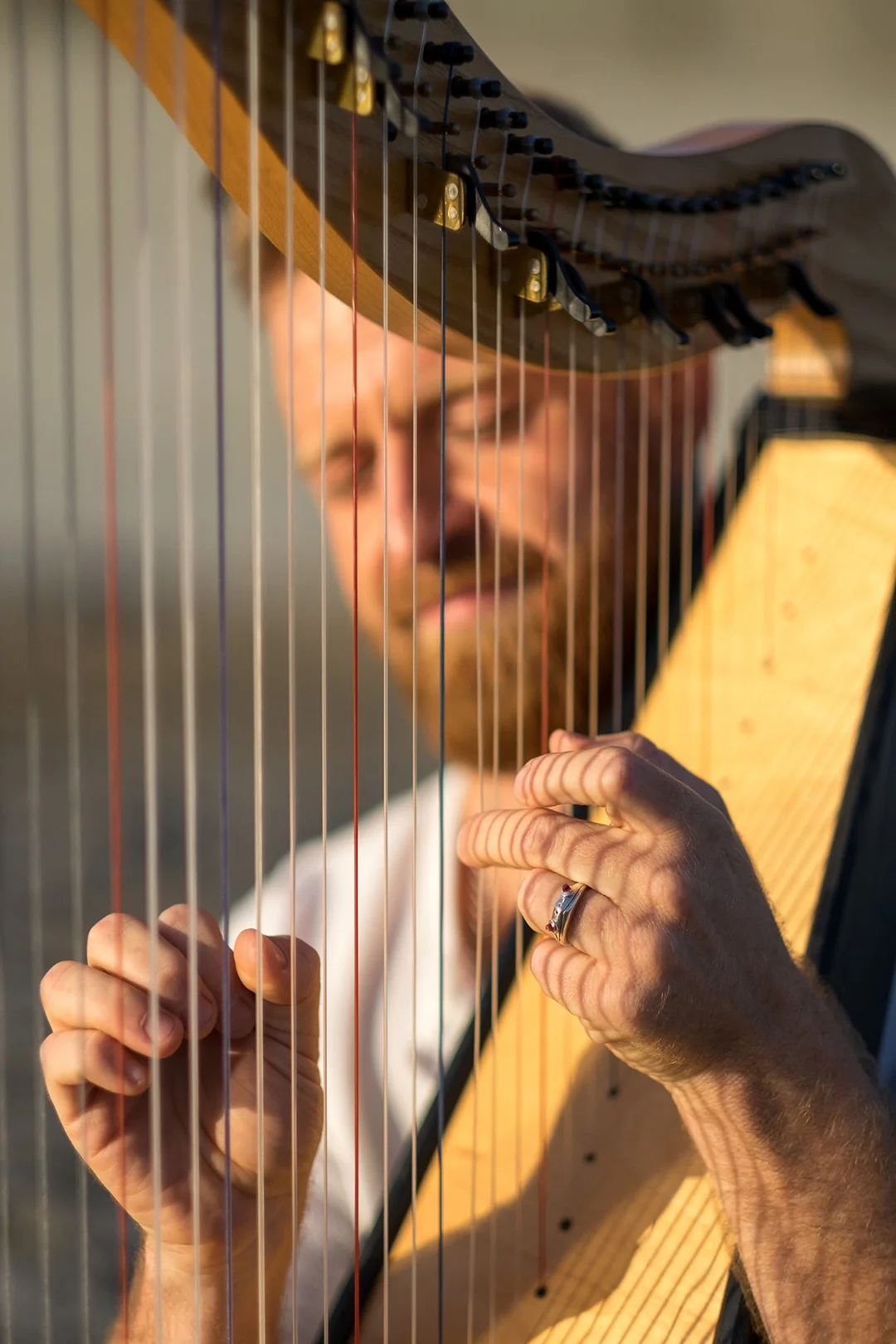 Justin Mosley playing the harp